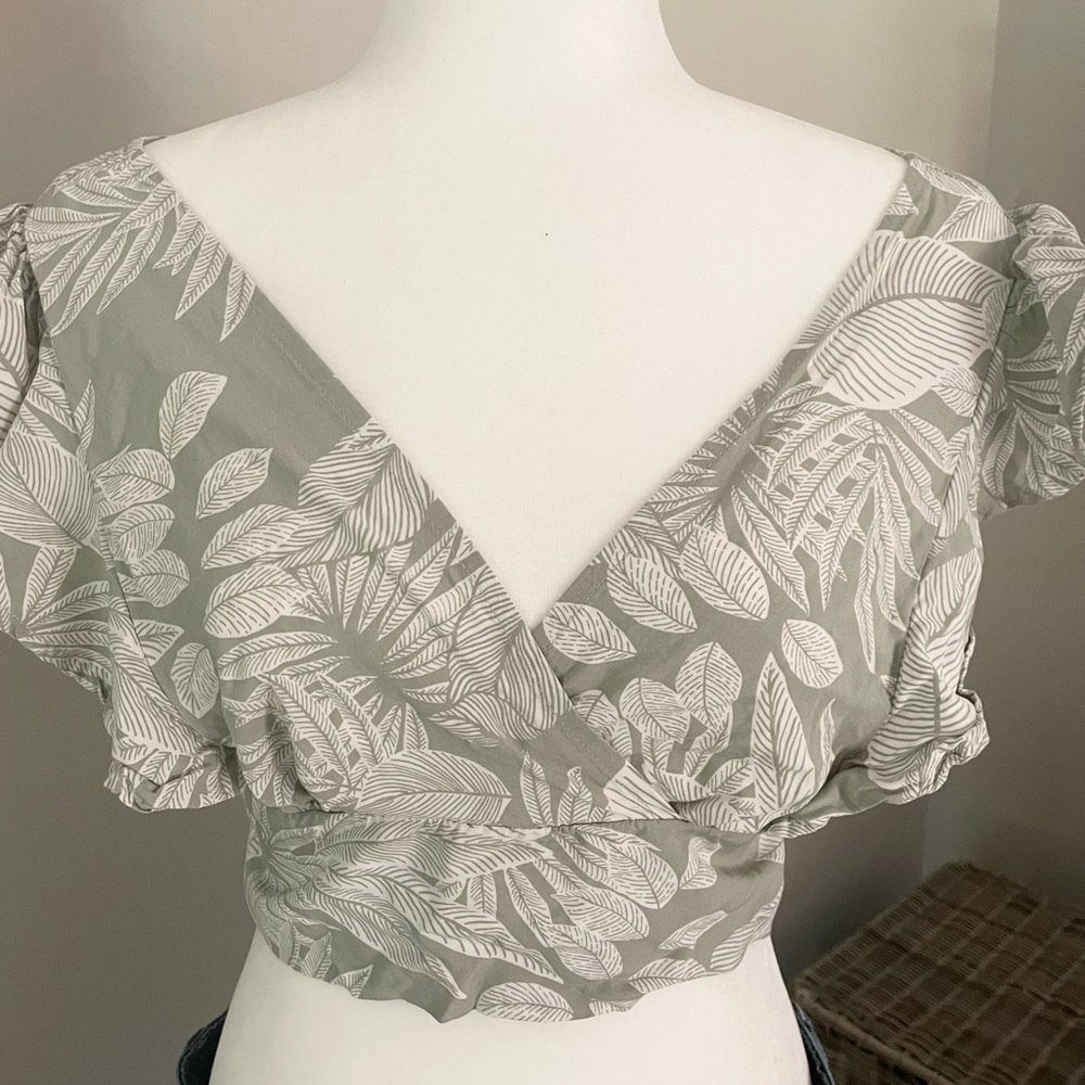 Final touch women’s crop top with tie back detail.
